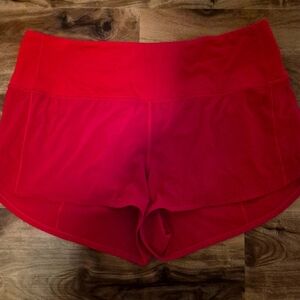 LULULEMON RED SHORTS IN A SIZE 12